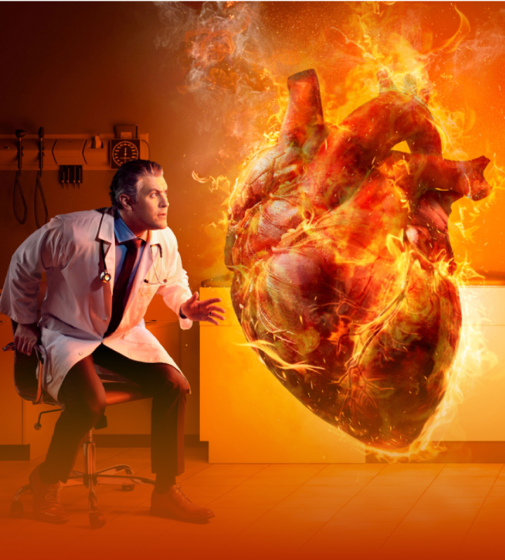 Doctor jumping out of his chair next to a large flaming heart